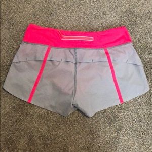 Greg & pink pinstriped Lululemon Speed Up short.